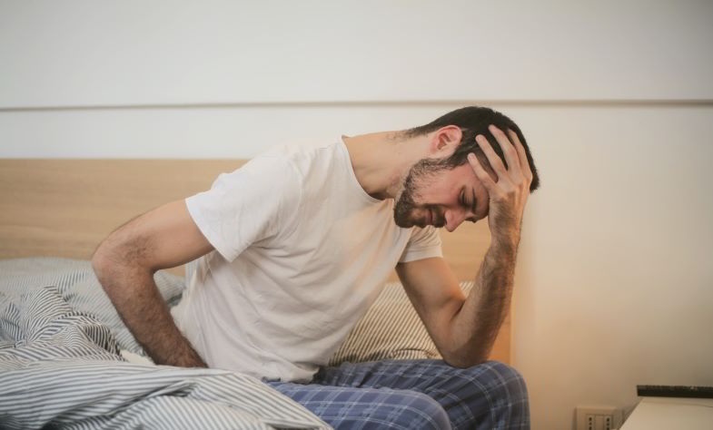 Man suffering from the inflammations of the disease