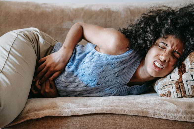 Woman suffering from menstrual cramps