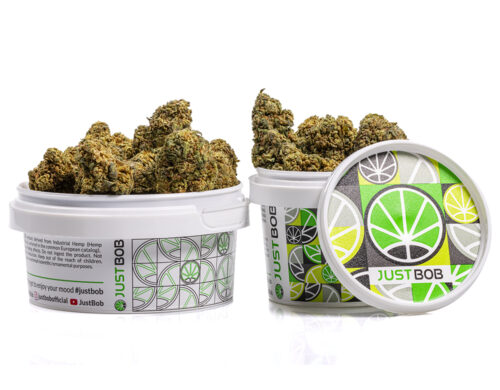 tin with flowers of orange cbd boost cannabis