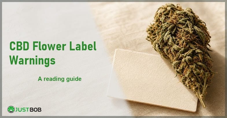 Justbob CBD Flower Label Warnings banner with green title, a hemp flower bud and a blank label card on cream linen