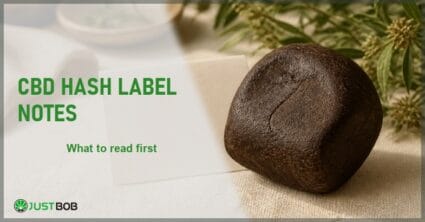 Justbob CBD Hash Label Notes banner with green title, a pressed block of CBD hash and a blank label card on cream linen