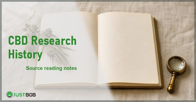 Justbob CBD Research History banner with green title, an open blank notebook and a dried hemp sprig on cream linen