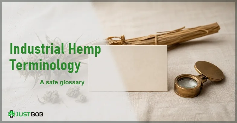 Justbob Industrial Hemp Terminology banner with green title, a dried hemp stalk, hemp flower buds and a blank index card on cream linen