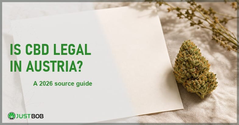 Justbob Is CBD Legal In Austria banner with green title, a hemp flower bud and a blank document sheet on cream linen
