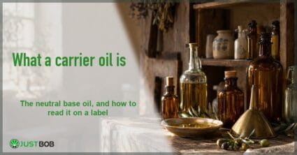 Light Justbob banner panel with a green title beside amber oil bottles, a dish of golden oil and a brass funnel on old wood